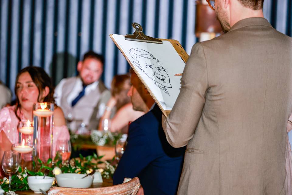 artist sharing a drawing with guests