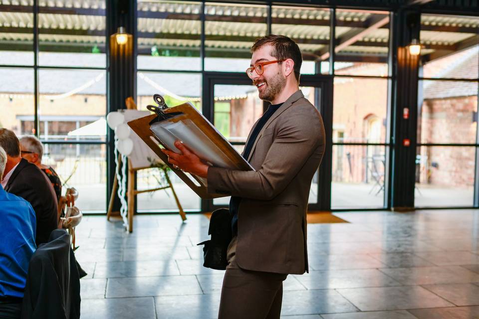 artist showing caricature in hallway