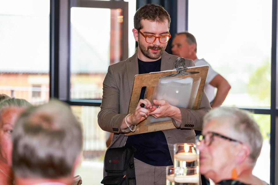 artist showing finished drawing