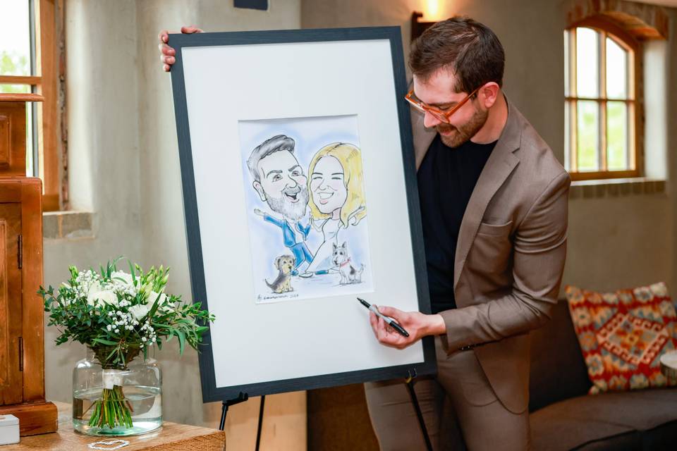artist showing portrait to a guest