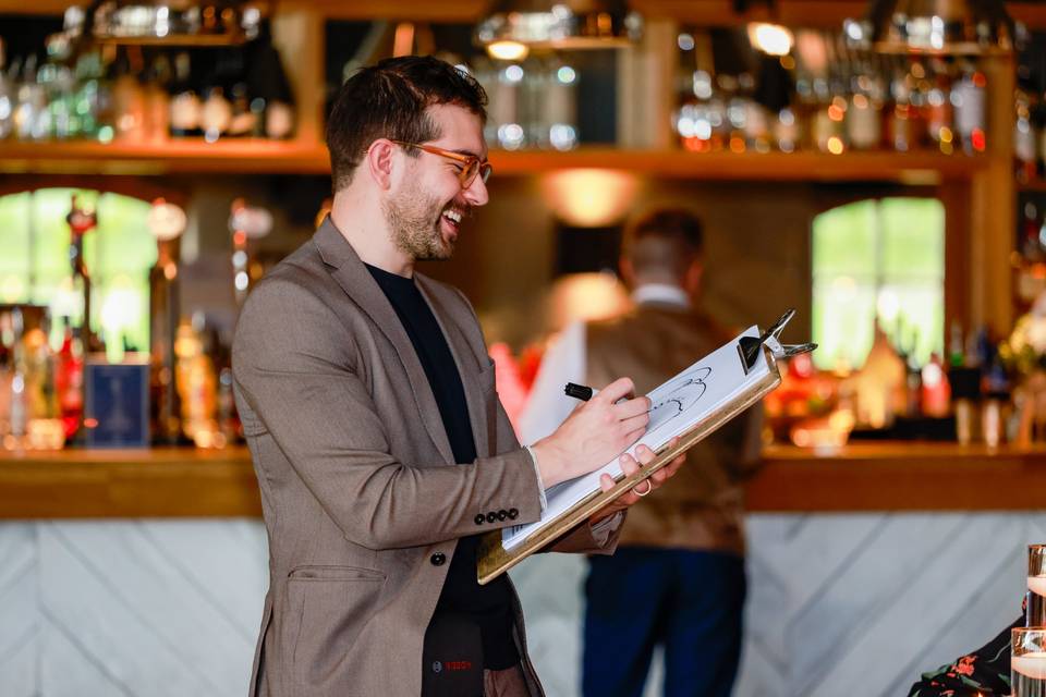 artist sketching in bar interior