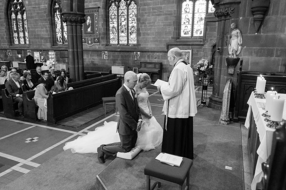 Kneeling before the vicar