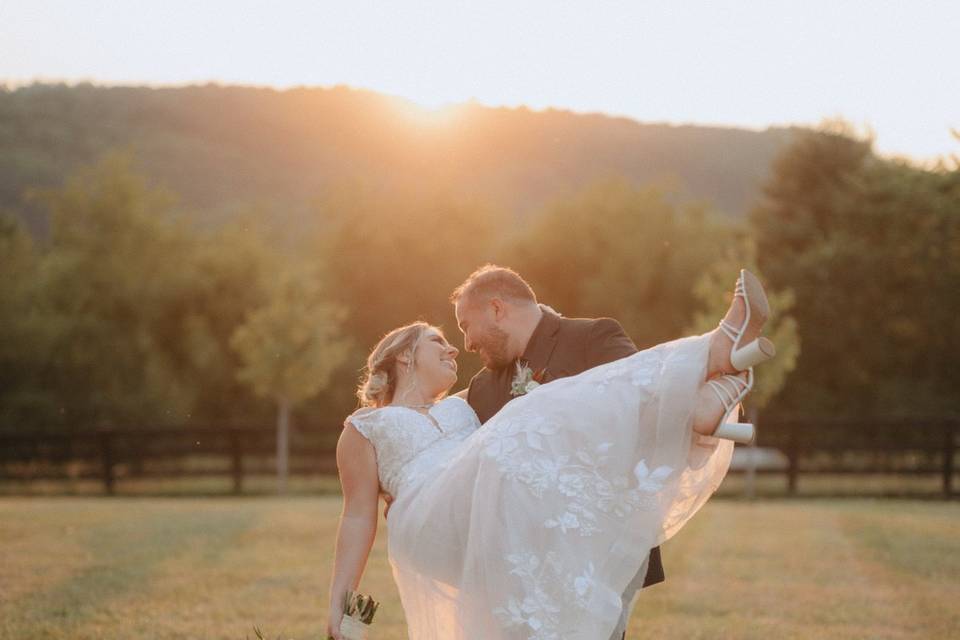 Bride and Groom Lift at sunset