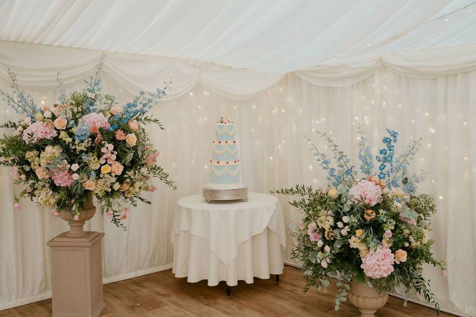 Urns next to cake