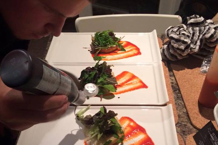 Chef plating up starters