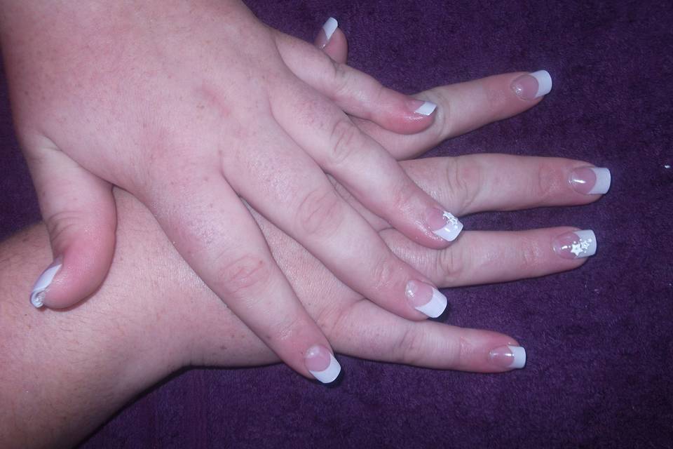 Acrylic nail extensions with white tips and nail art