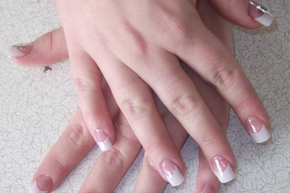 Acrylic nail extensions with white tips