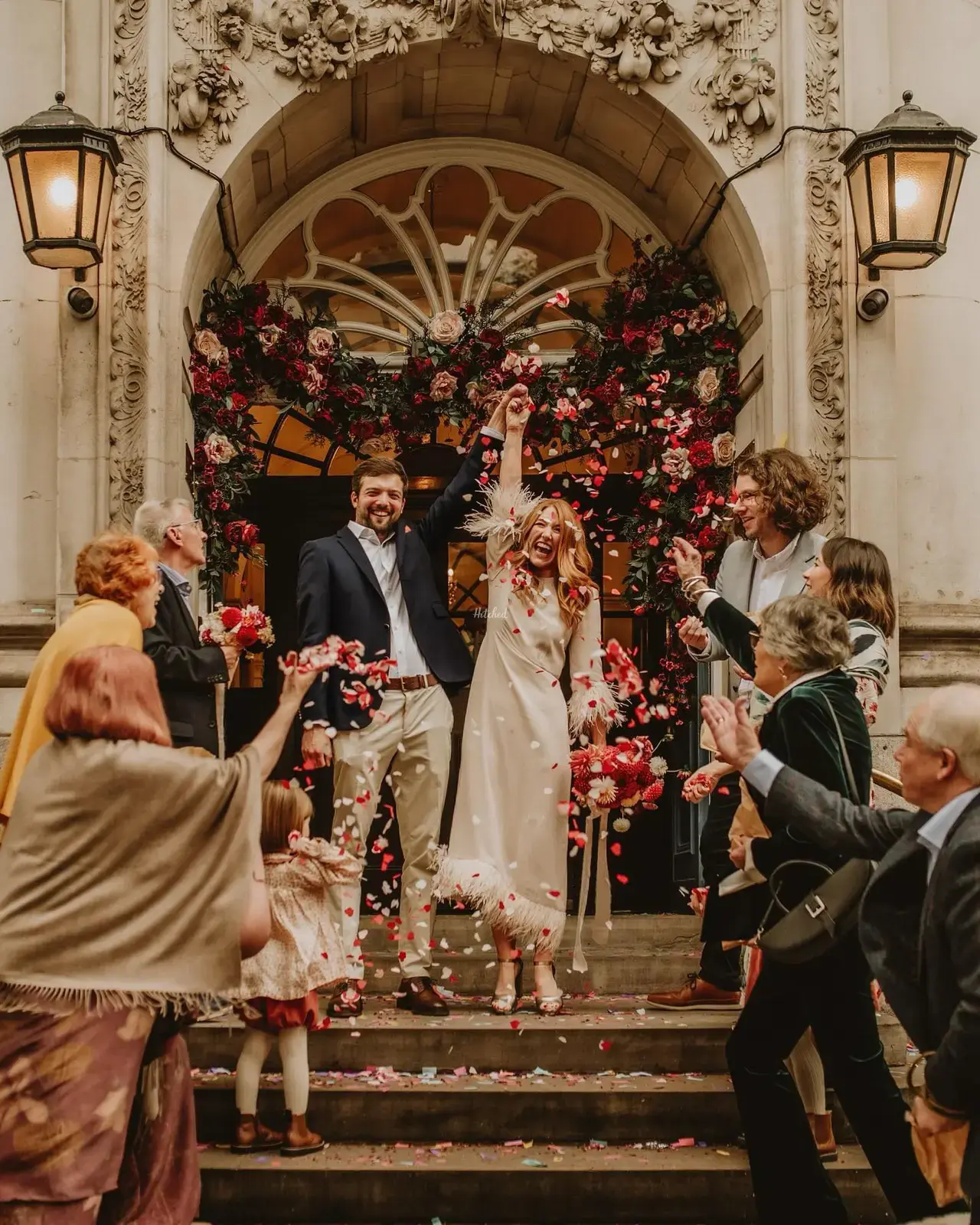 Bride and groom pictured outside the Chelsea Old Town Hall as guests throw confetti