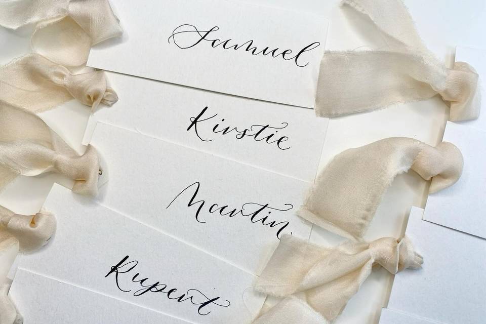 Place cards with calligraphy