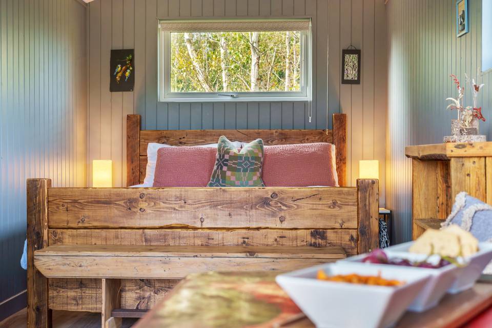 Rustic bed in cabin