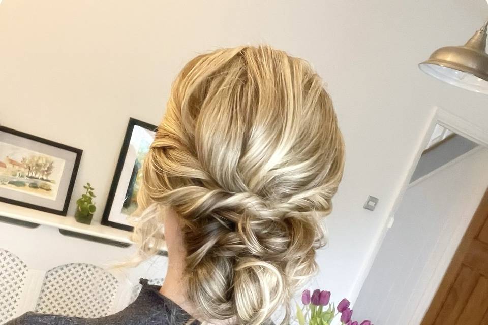 Textured “undone” bun