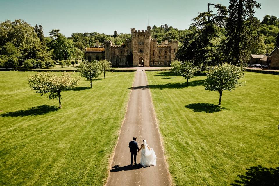 Newlywed couple on driveway