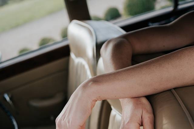 Pearl-handled bouquet in the wedding car