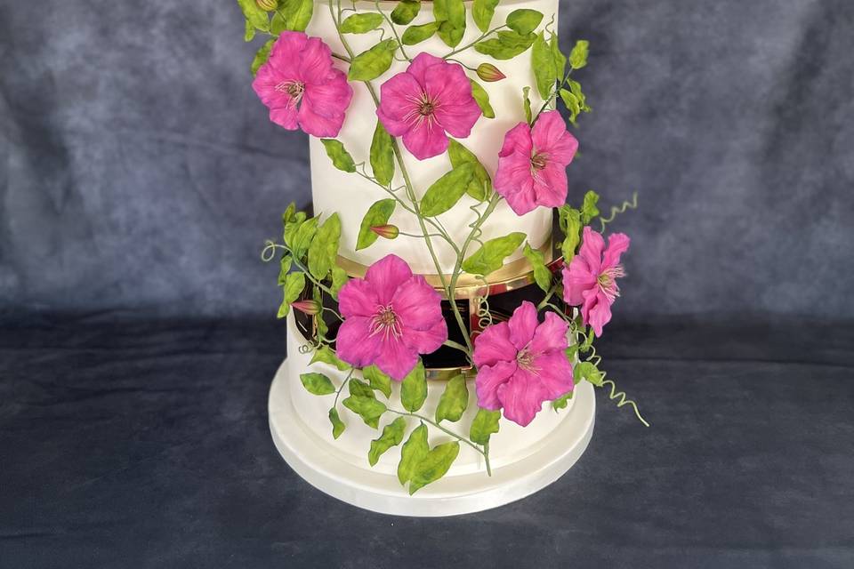 Three tier cake with clematis