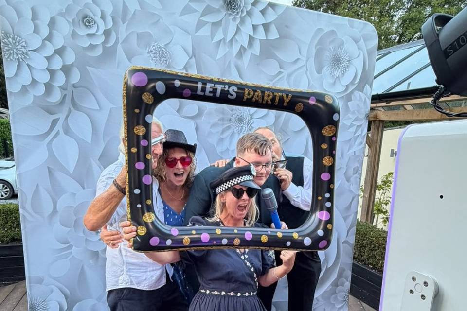 Photo booth fun with wedding guests