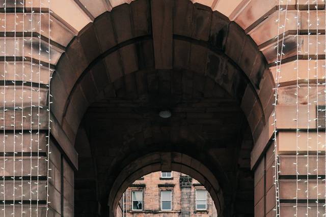 Newlyweds beneath arch