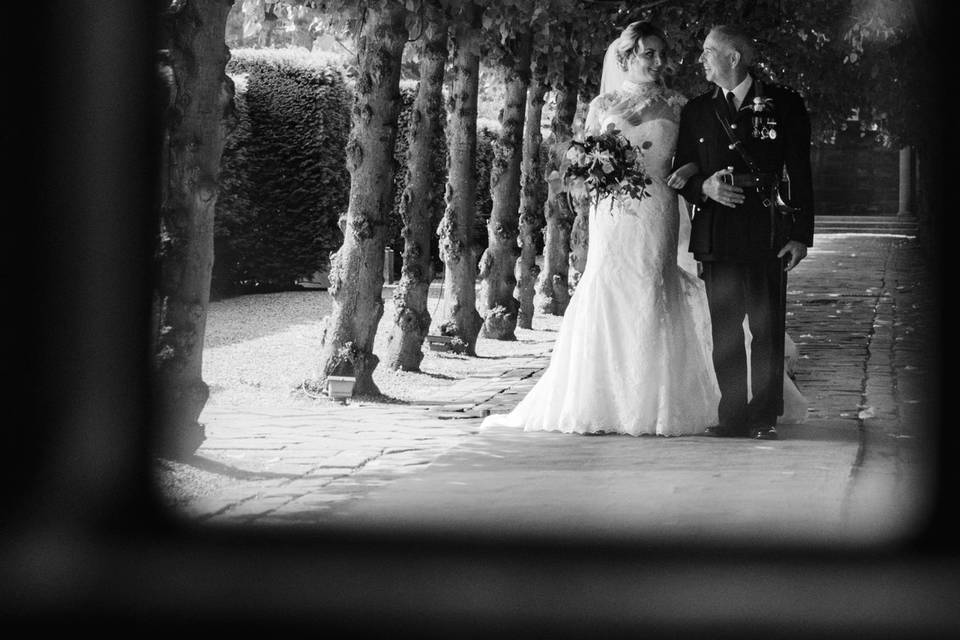 Bride and dad walking in