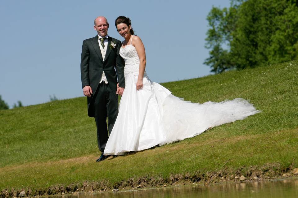 Bride & groom by the lake