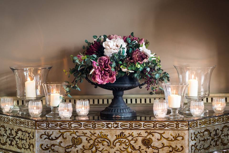 Silk flowers in black urn