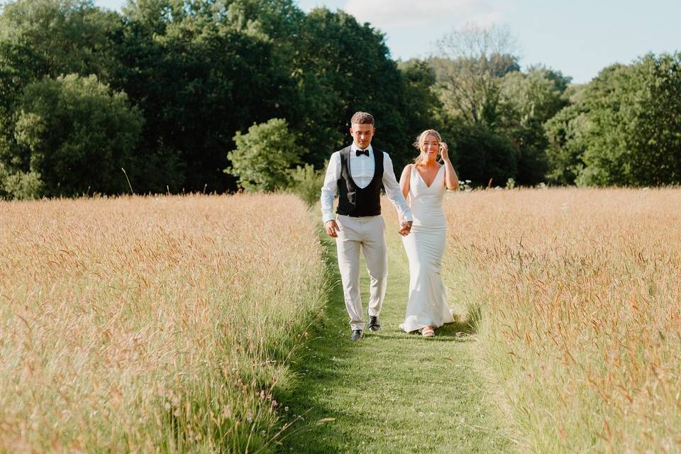 Couple walking at the meadow