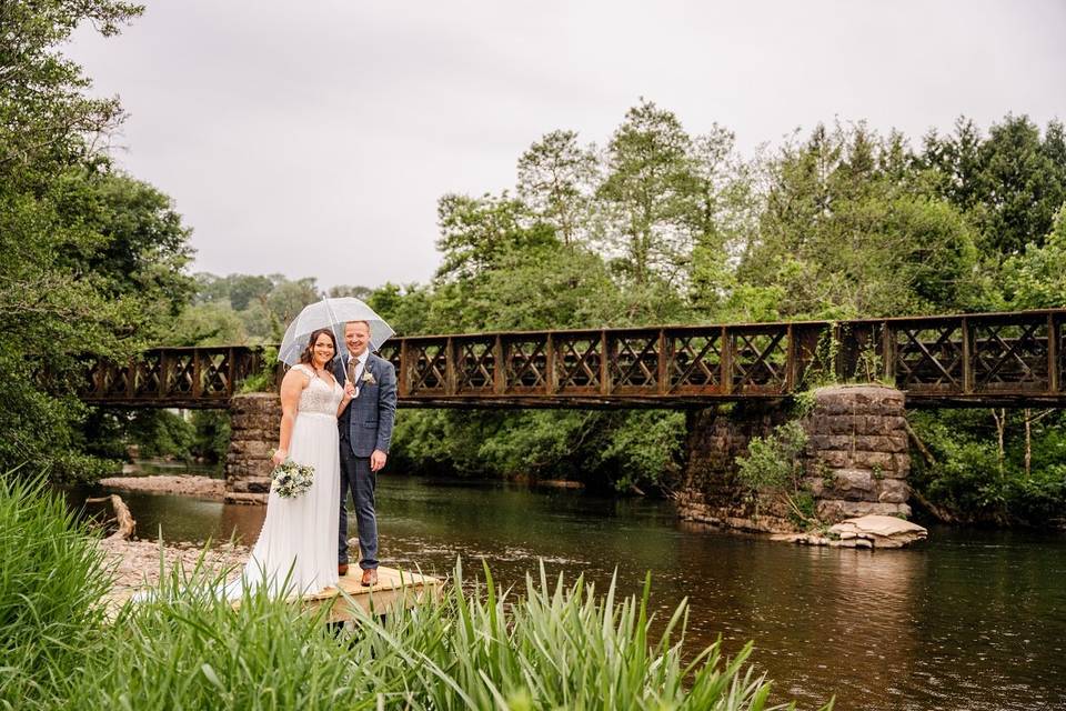 Couple on jetty at river