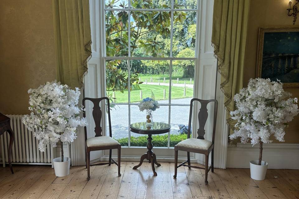 Window and white blossom trees