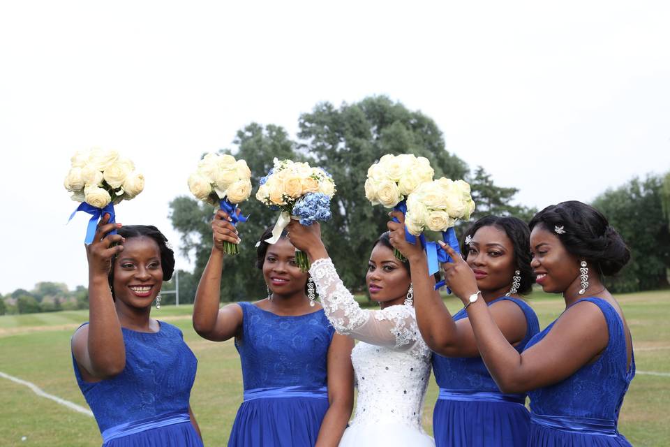 Bride & bridesmaids at park