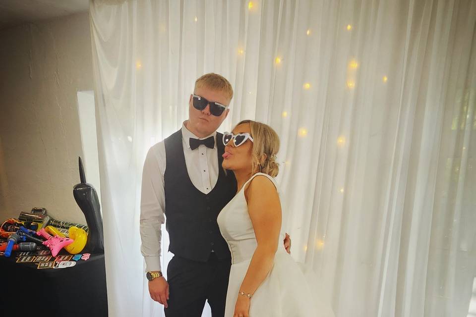 Bride and groom striking a pos