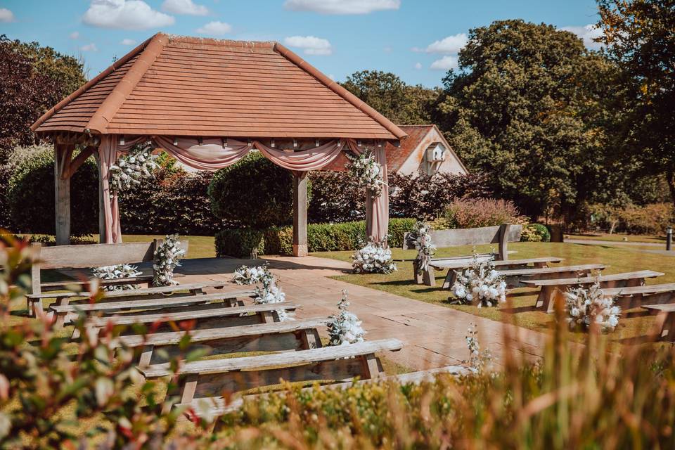 Pergola draping and florals