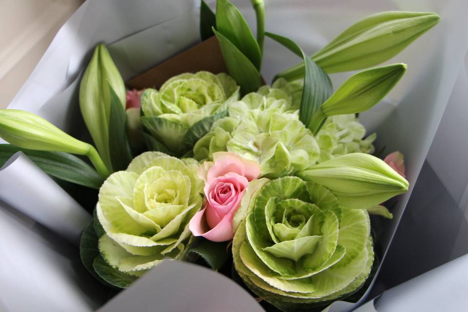 Lilies, roses and brassica