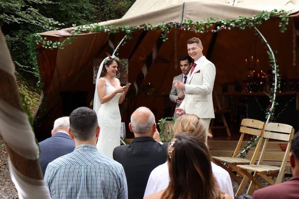 Newlyweds smiling at ceremony