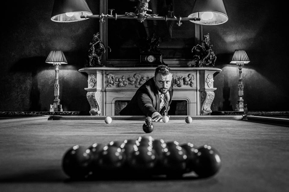 GROOM PREP IN BILLIARD ROOM AT