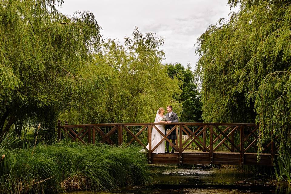 Newlyweds on a bridge - SMH Photography