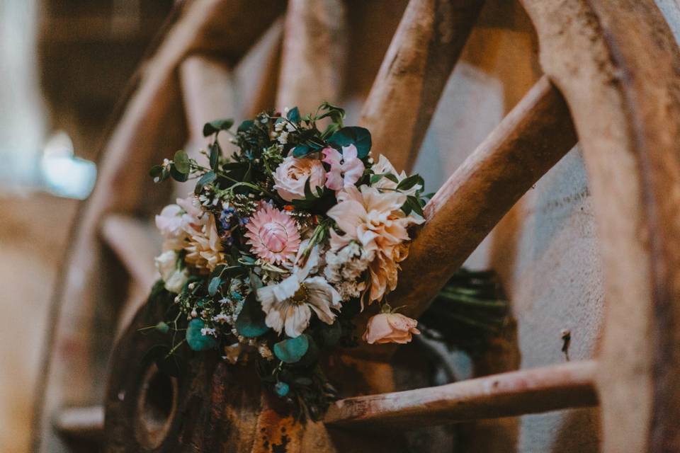 Wheel and floral decor