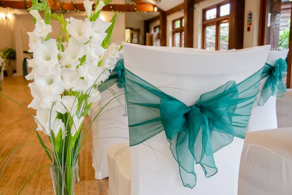 Gladioli and chair covers