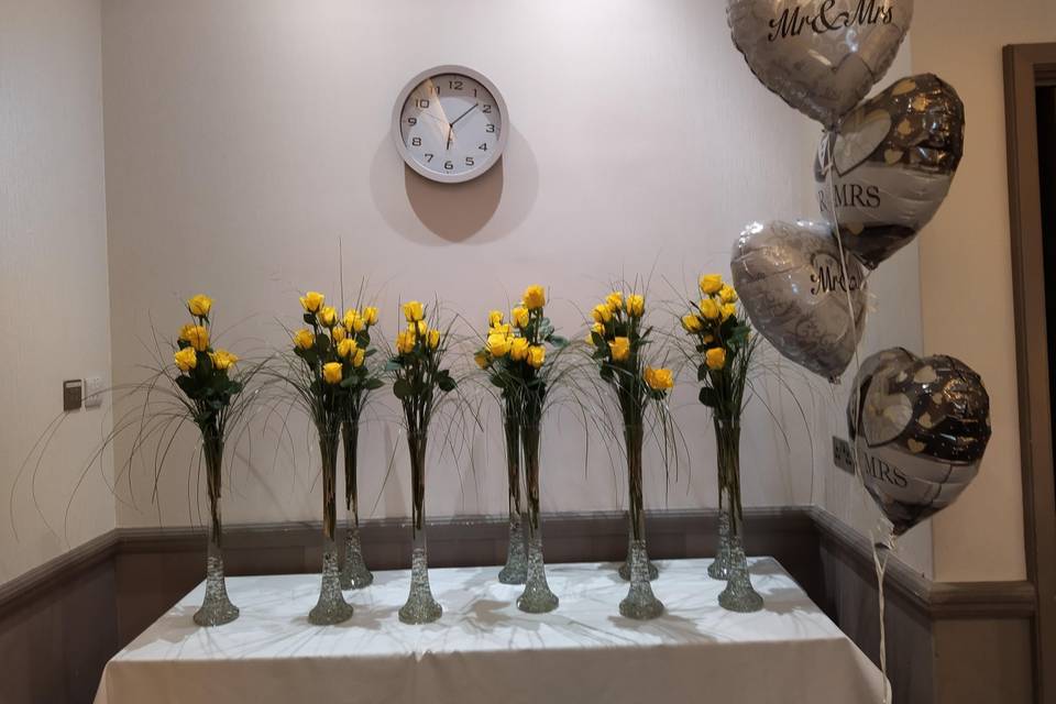 Yellow rose lily vases