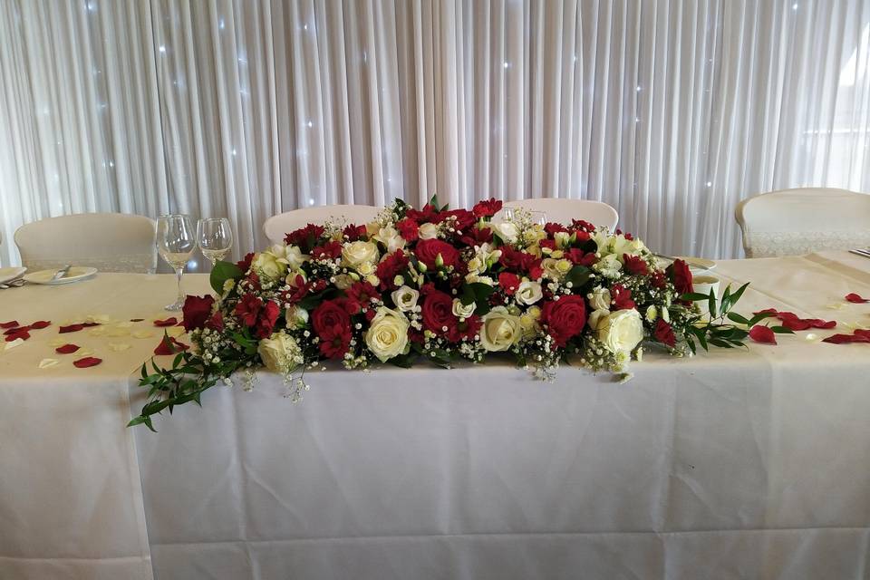 Red and ivory top table flower