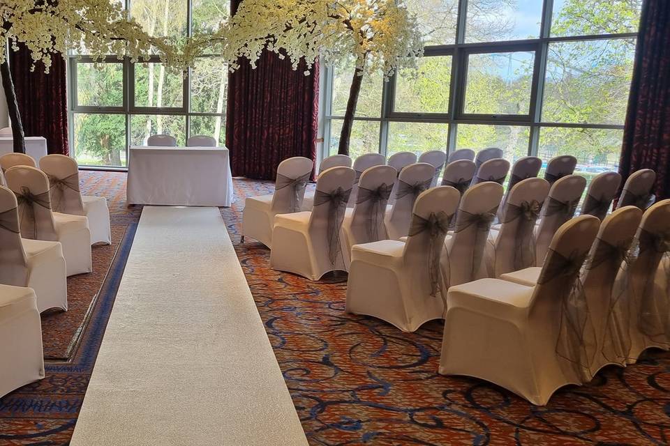 Chair covers and blossom arch