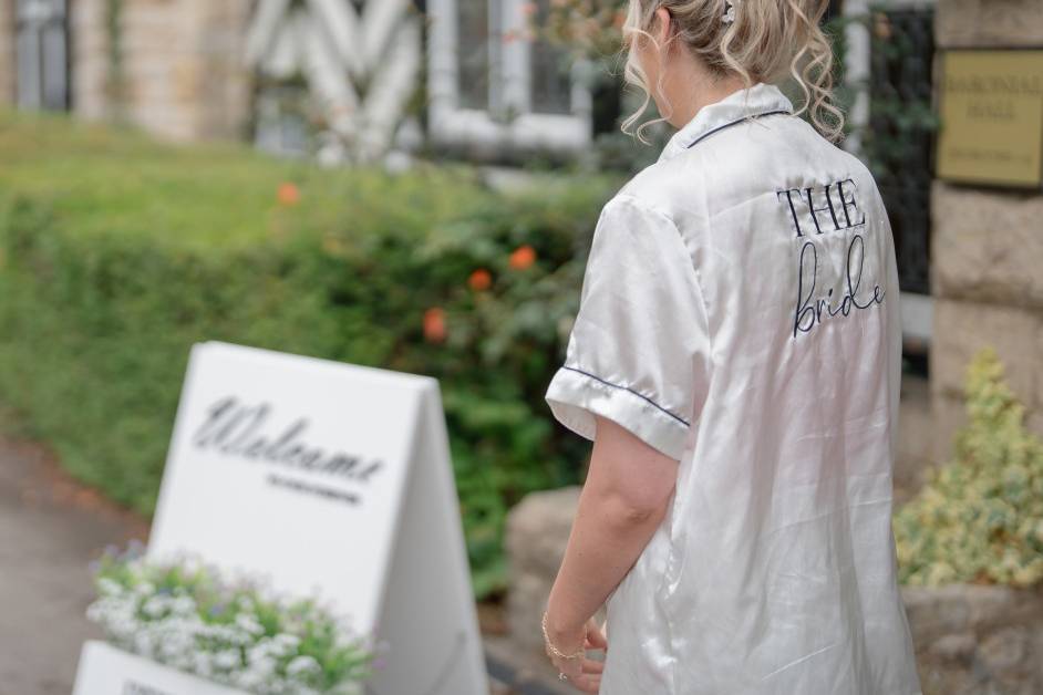 Bride and welcome sign