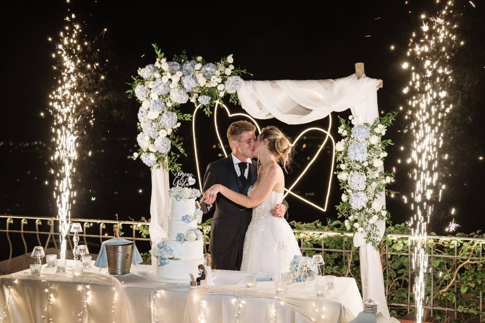 Wedding cake cut with kiss