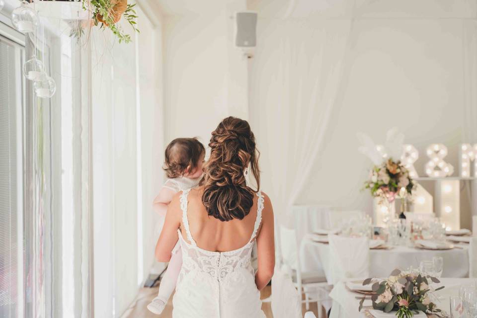 Bride holding baby