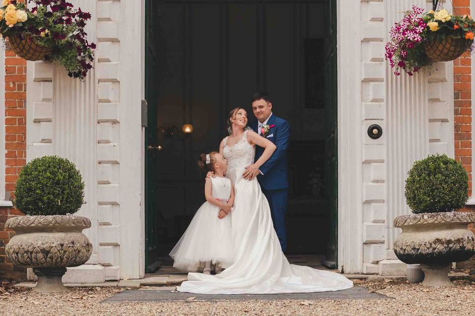 Couple in front of big door.