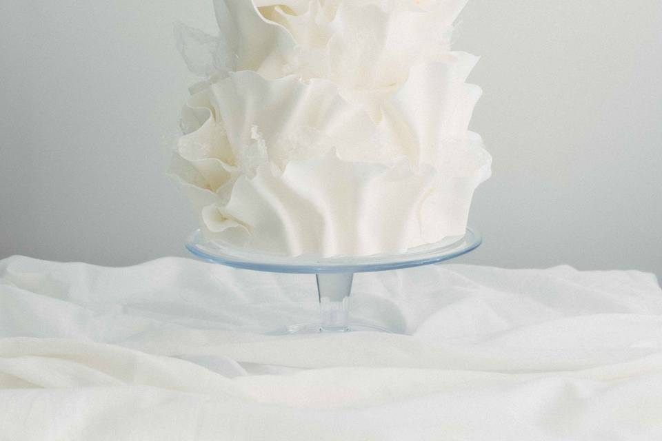 Ivory ruffle wedding cake