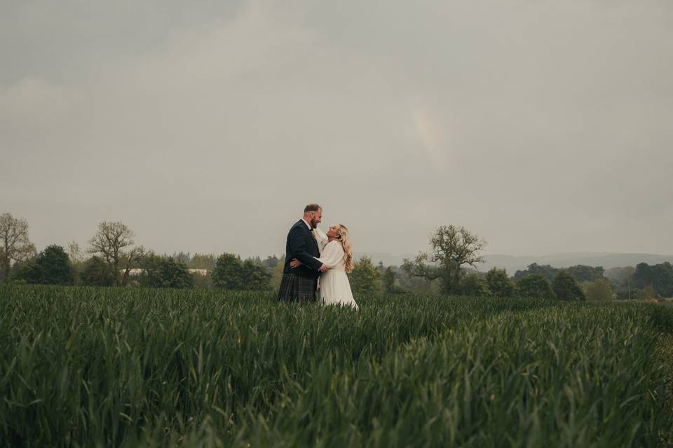 Farm field couple laughter