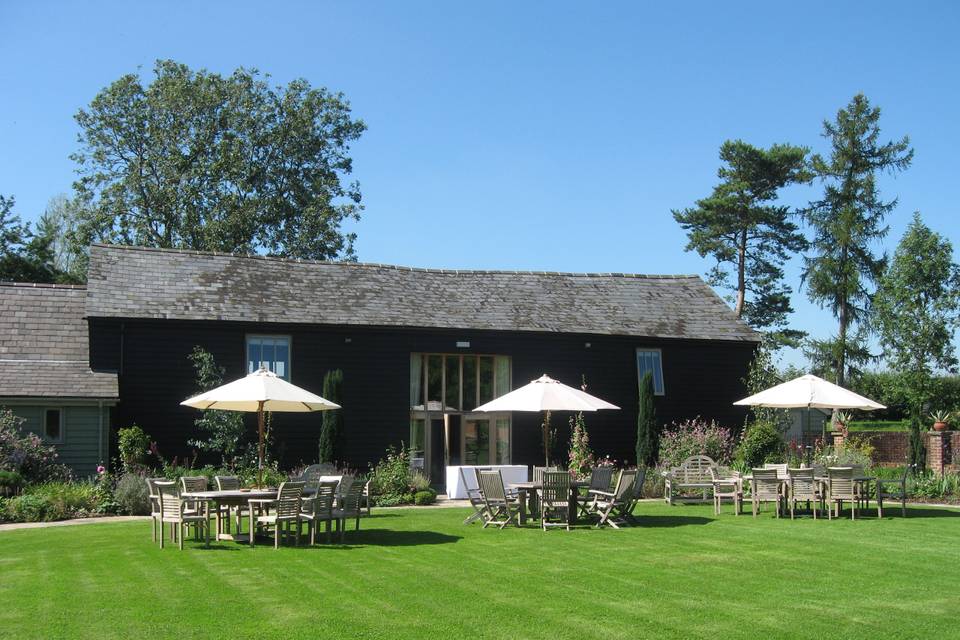 Tables and chairs set out in front of The Garden Barn