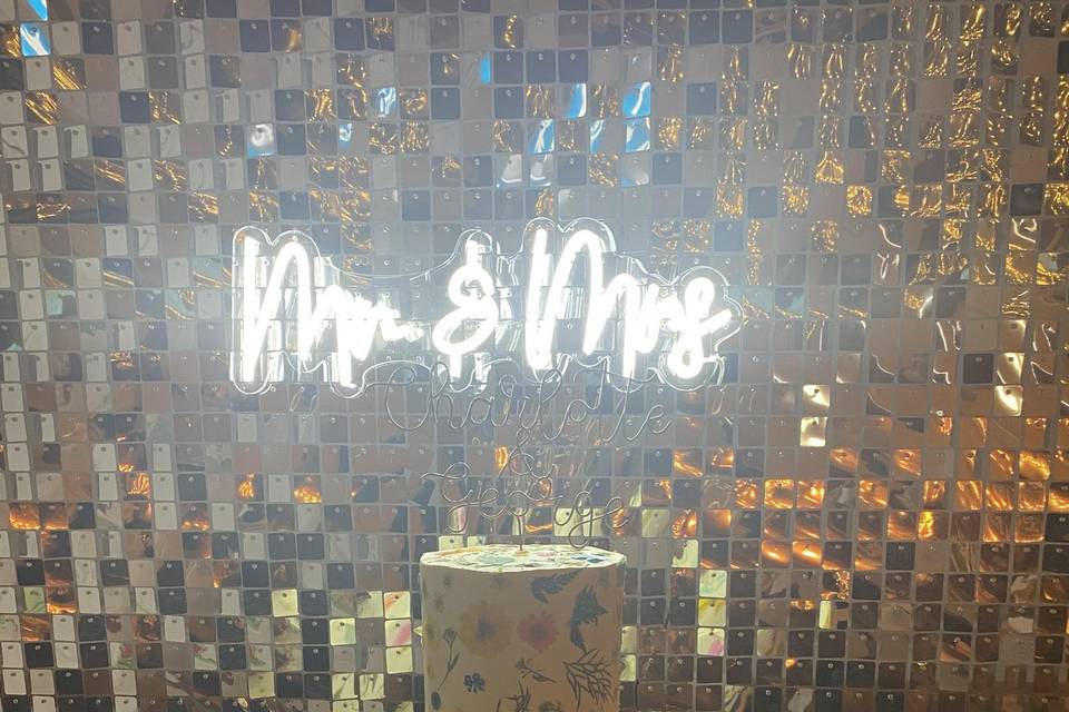 Sequin backdrop with neon sign