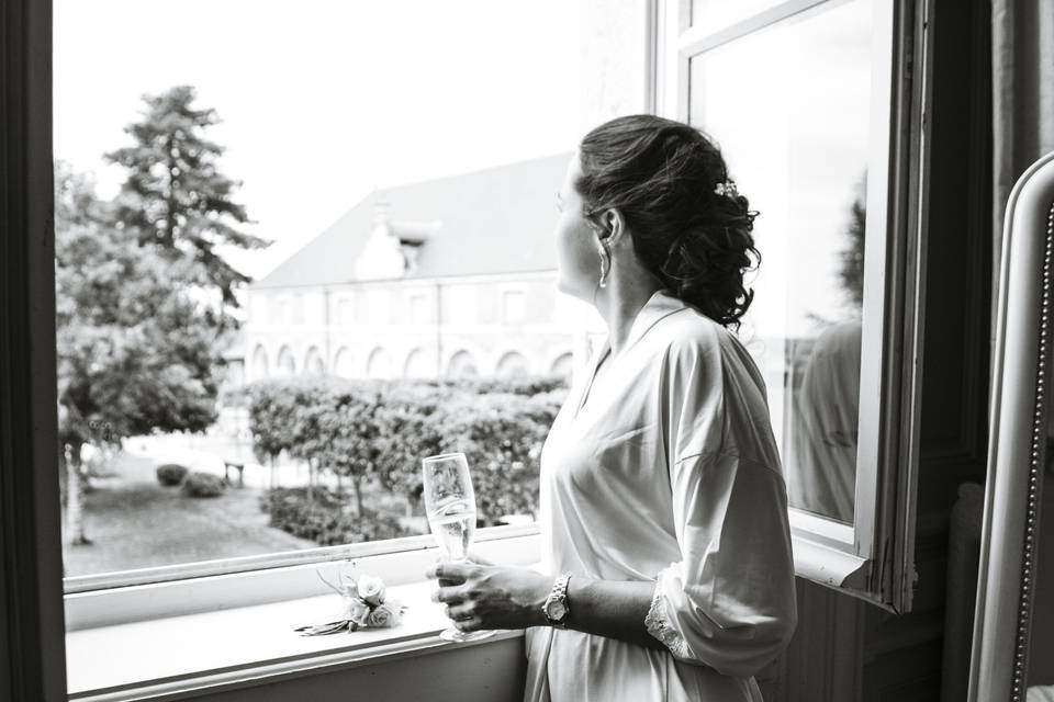 Bride looking out of window