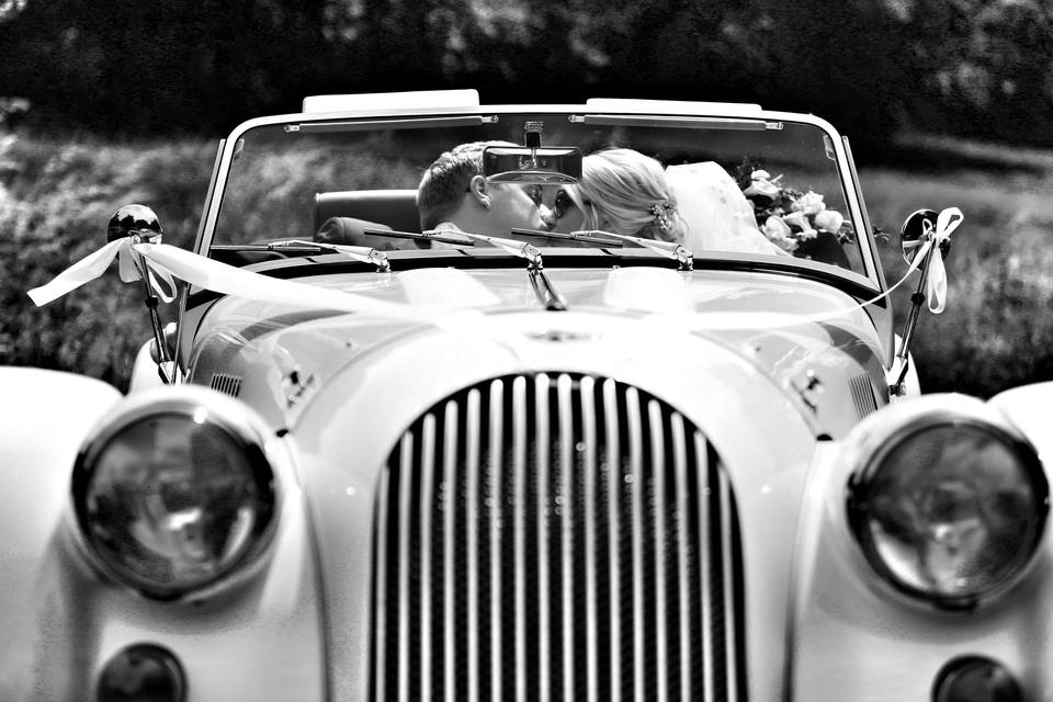 Kissing in a vintage car