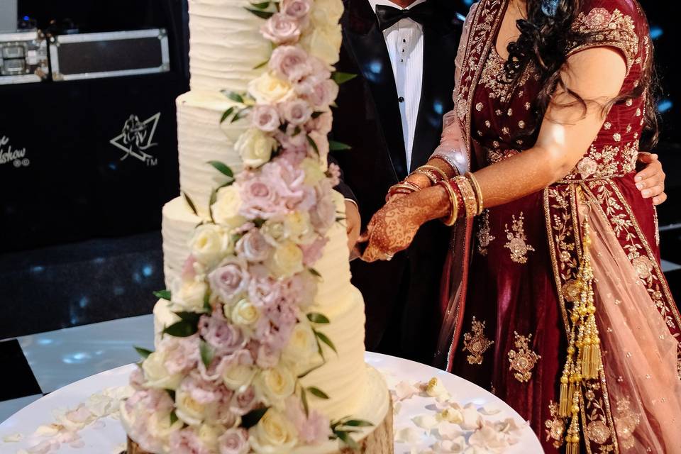 Asian couple cutting cake