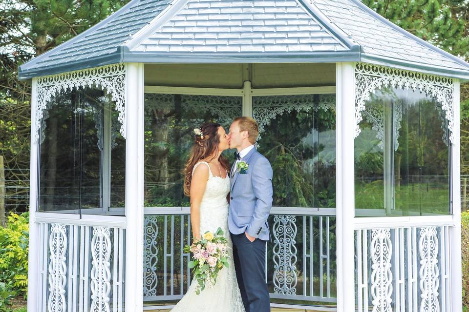 Couple pose in summer house